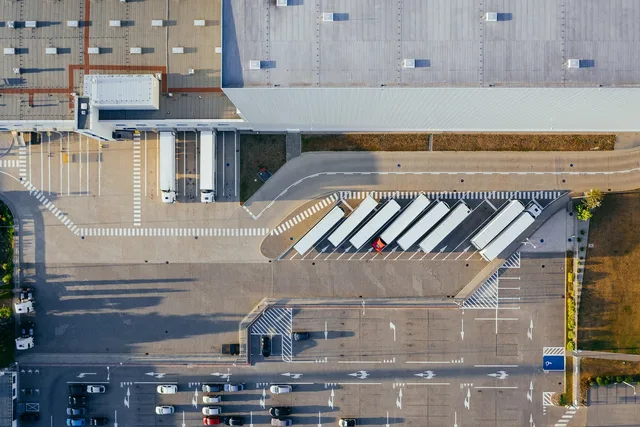 production, facility, logistic, distribution center, transit, truck, transport, top view, industrial, semi, aerial view, heavy, depot, germany, warehouse, container truck, shipping containers, storehouse, road, loading bay, factory, unloading, distribute, unload, europe, aerial photography, production, logistic, truck, truck, warehouse, warehouse, warehouse, warehouse, warehouse. Moving Company Quality Control: Four Monthly Sources