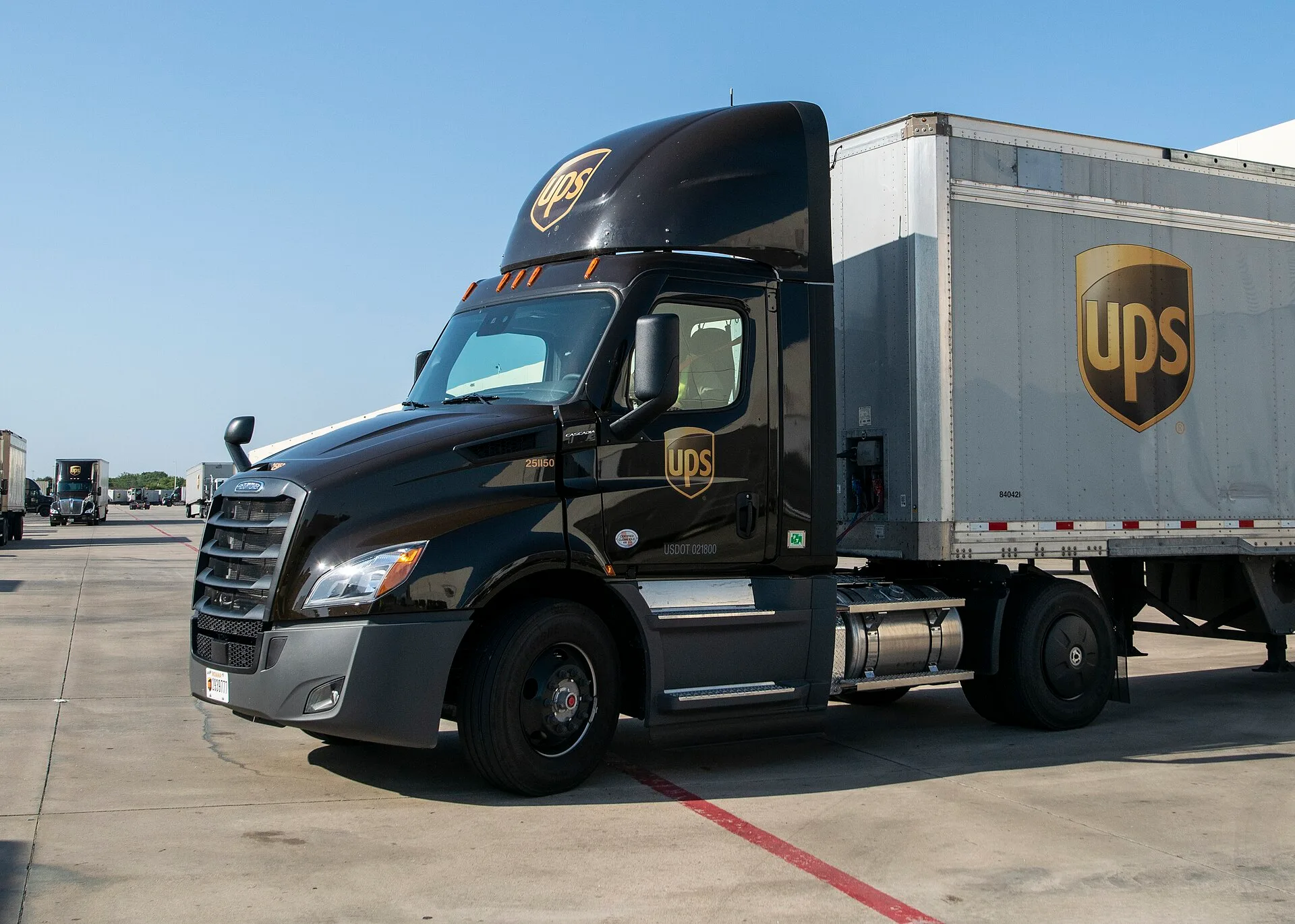 UPS feeder driver Birrill Taylor backs his assighed new diesel tractor to an offload dock at the UPS Lone Star distribution center (hub), in Arlington, TX, on August 14, 2020. Today, he picked up a trailer full of these boxes from Pro Pac Quality Packaging who pack and label the boxes for PepsiCo, w. Why movers charge per hour differently across US cities