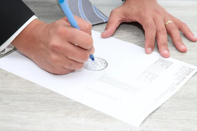 paper, document, stamp, signature, signing, deal, hands, signature, signature, signature, signature, signature. Moving company contract clauses and the disputes they prevent