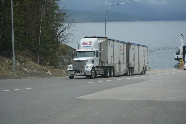 truck, lorry, white truck, nature, cargo truck, big rig, transportation, vehicle, highway, lake, driving, truck drivers, truckers, lorry driver, gray truck. Moving company equipment: the daily count routine